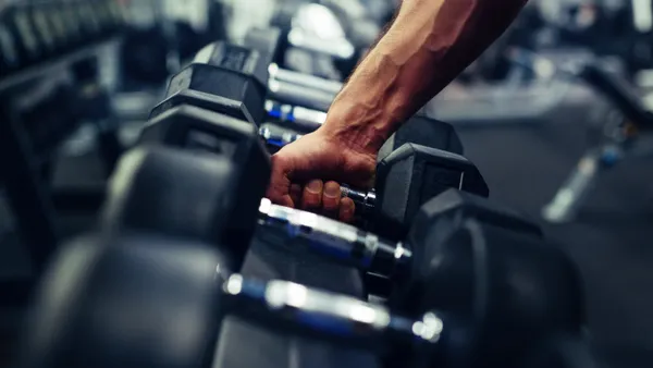 Barbell strength training detail at Iron Forge